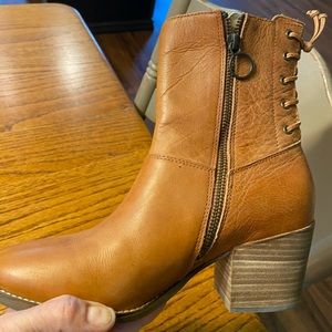 Tan leather heeled boots.  Lace up detail in back.  Worn once.